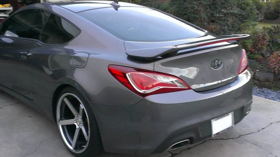 Rear view of a gray sports coupe with tinted windows by TNT Window Tinting