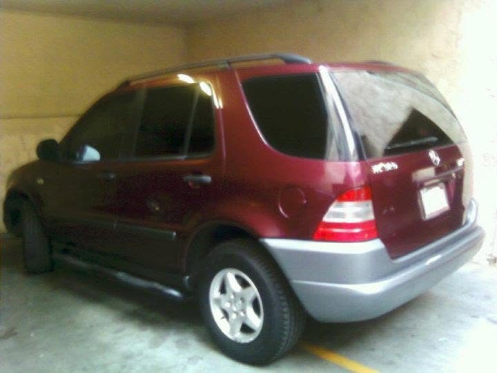 Luxury SUV with tinted windows by TNT Window Tinting